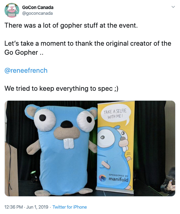 Giant Plush Gopher and Taka a selfie banner next to it